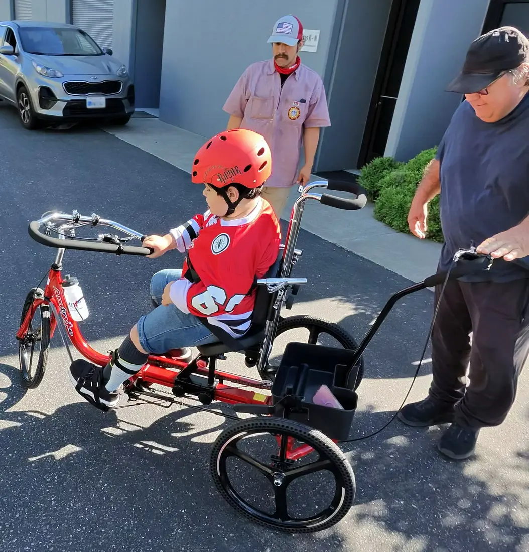Lukas riding his red Paceline 16.
