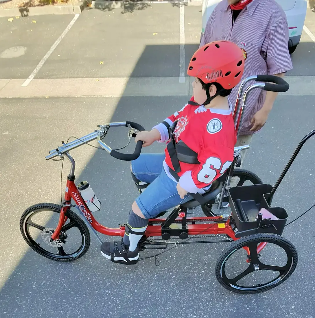 Lukas smiling while seated on his Paceline 16.